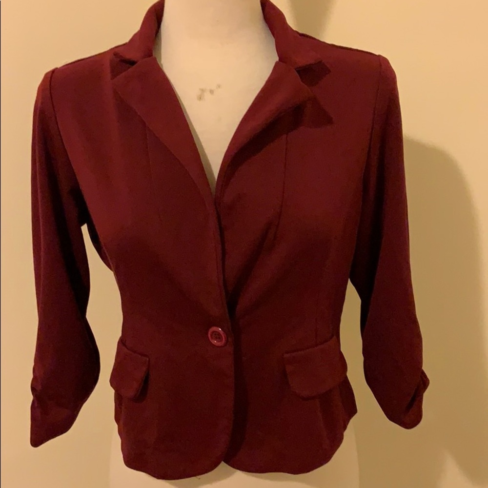Burgundy blazer.